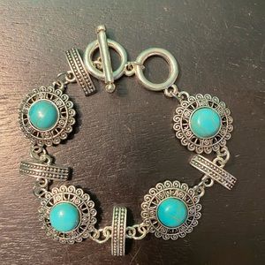 Circle shaped turquoise inspired charm bracelet, with toggle enclosure.